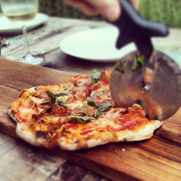 Pizza being cut